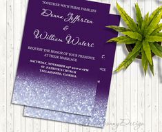 two purple and white ombreed wedding cards next to a potted plant