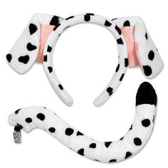 a dalmatian headband with black and white spots on the front, and pink lining