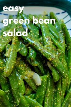 green beans with seasoning in a blue and white bowl