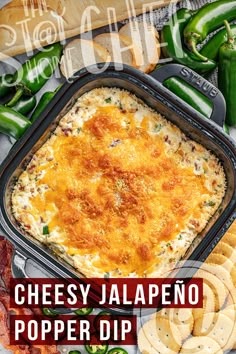 This contains: Overhead view of dip in a pan with ritz crackers on the side Jalapeños Popper Dip, Jalapeño Dip Recipe, Jalapeño Popper Dip Recipe, Jalapeno Pepper Dip, Halopinio Popper Dip, Jalapeno Popper Dip Easy, Jalapeno Poppers Dip, Jalepeno Dip Recipes, Jalopena Popper Dip Crockpot