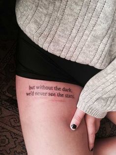 a woman's leg with a tattoo saying, but without the dark we'd never see the stars