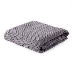 a gray blanket folded on top of each other