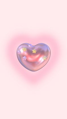 a heart shaped object floating in the air with stars on it's back side