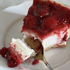 a piece of strawberry cheesecake on a plate with a fork