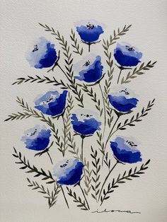 watercolor painting of blue flowers on white paper