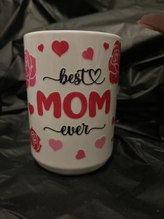 a coffee mug with the words best mom ever written on it and hearts all over it