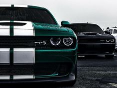 several cars parked in a parking lot with one green and white stripe on the front