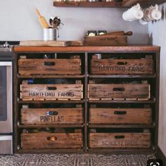 a kitchen with wooden crates on the counter