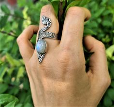 Exclusively Handmade Sterling Silver Ring with Natural Moonstone Gemstone. Handmade, one of a kind Masterpiece Long Knuckle Ring Ring weighs 10 grams. Size can be Adjusted from size 6 US to size 10 US Get back into your groove with the Moonstone crystal, the dreamy, ethereal stone that channels the moon, a force that has the power to push and pull the tides of our great oceans and your emotions. Keep Moonstone close by and feel the glow of the moonlight infusing your chakras with its brilliant w Bohemian Adjustable Stackable Moonstone Ring, Adjustable Stackable Bohemian Moonstone Ring, Unique Adjustable Moonstone Ring, Unique Adjustable Open Moonstone Ring, Unique Handmade Adjustable Moonstone Ring, Handmade Adjustable Moonstone Ring, Unique Adjustable Moonstone Open Ring, Handmade Adjustable Unique Moonstone Ring, Adjustable Unique Open Moonstone Ring