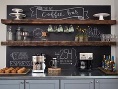 the coffee bar is decorated with chalkboard and wooden shelves, along with cupcakes