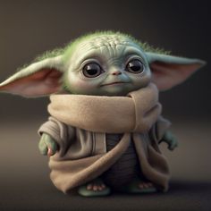 a baby yoda doll sitting on top of a table