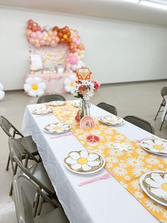 the table is set with plates and place settings for two people to sit down at