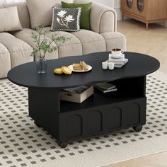 a black coffee table sitting on top of a rug