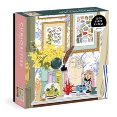 a puzzle box with flowers and pictures on it