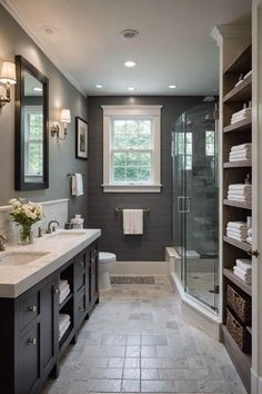 a bathroom with gray walls and tile flooring