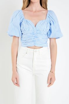 Add some flair to your wardrobe with this Stripe Shirred Detail Top. A sweetheart neckline and shirring detail along the front and armholes of this top make for a timeless contented look. Floaty balloon short sleeves let you show off your signature style while keeping you comfortable all day long. Let the unique stripe pattern of this top set you apart from the crowd. It's time to make an impression! Sweetheart neckline Balloon short sleeves Stripes Side invisible zipper closure Lined Shirred details Elastic at sleeve cap Hand wash cold Do not bleach Do not tumble dry Iron low Shell: 100% Cotton Lining: 95% Polyester 5% Cotton Exclusive of Elastic JJ2090T Total length :17" Bust :34" S BLUE STRIPE: Height 5'9" / Bust 32" / Waist 24.5" / Hip 34" Brunch Tops, English Factory, Casual Party Dresses, Maxi Dress Sale, Fashion Night, Pink Maxi Dress, Pink Outfits, Bottom Clothes, Sweater And Shorts