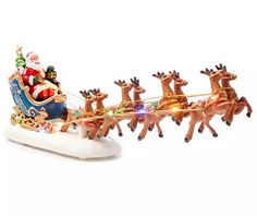 a santa claus sleigh with reindeers and lights on it's side