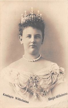 an old photo of a woman wearing a tiara