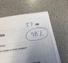 a piece of paper that has been written on it with the number 981 and is next to an answer