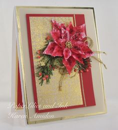 a red and gold christmas card with poinsettis