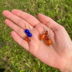 This listing is for two pairs of earrings in orange and blue. Wear each pair, or mix and match for a unique look. The orange and blue color scheme is perfect for an Auburn fan, or anyone who loves the color combination. Only one set is available! Everyday Colorful Beads Orange Jewelry, Vibrant Blue Drop Earrings, Everyday Hypoallergenic Orange Earrings, Vibrant Blue Dangle Earrings, Vibrant Orange Dangle Jewelry, Vibrant Orange Drop Earrings, Everyday Hypoallergenic Orange Jewelry, Nickel Free Orange Earrings For Everyday, Nickel-free Orange Earrings For Everyday Wear