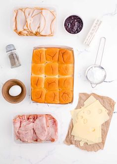 ingredients to make ham and cheese sandwiches laid out on a table