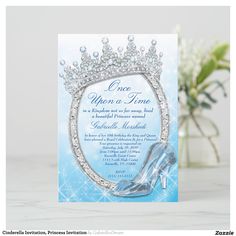 a card with a shoe and tiara on it next to a vase filled with flowers