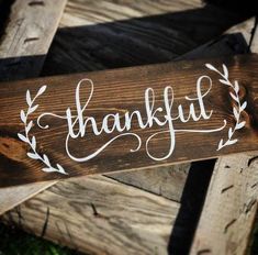 a wooden sign that says, thank