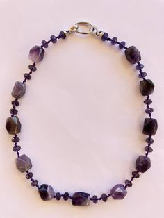 I handcrafted this bohemian-style necklace using the silk knot technique. It is assembled from large faceted natural amethyst stones and Austrian crystals on silk thread. Only two necklaces available in stock. To place an order, please contact me. Feel free to contact me for further details or if you have any questions. For more information, check my Instagram profile. https://www.instagram.com/health_andmood?igsh=ZGNjOWZkYTE3MQ%3D%3D&utm_source=qr Solar Two Necklaces, Amethyst Stones, Amethyst Necklace, Silk Thread, Austrian Crystal, Amethyst Stone, Crystal Necklace, Bohemian Style, Original Design