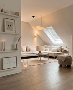 a living room filled with furniture and a skylight above the couch in front of it