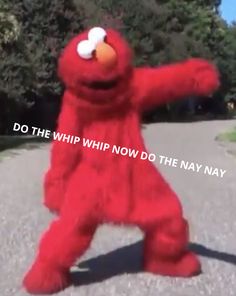 a large red stuffed animal standing on its hind legs with the caption do the whip now do the navy