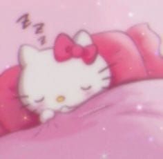 an image of a hello kitty sleeping on the bed