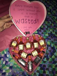 a heart shaped box filled with lots of bottles