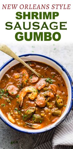 shrimp and sausage gumbo in a blue bowl with a wooden spoon on the side