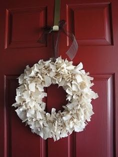 a wreath is hanging on the front door