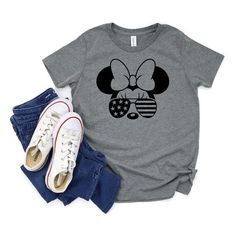 Our new Minnie Mouse USA Aviator tee is perfect for all kiddos who are going on a Disney vacation or cruise! They'll love wearing this super soft tee while enjoying a day at the Happiest Place on Earth! This shirt makes a great gift for all kids who are going on a Disney trip! The children’s version of the best-selling Bella+Canvas 3001CVC, the Bella+Canvas 3001Y is everything you’d hope for and more. It feels soft and lightweight, with the right amount of stretch. FABRICATION• 52% airlume combe Kids Disney Shirts, Minnie Mouse Shirts, Cousin Crew, Disney Mom, Heart Sunglasses, Disney Shirt, Bella Canvas Tees, Disney Family, Disney Kids