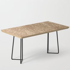 a table made out of cork with black metal legs on an isolated white background,