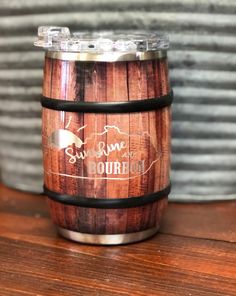 a wooden barrel sitting on top of a table