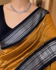 PRODUCT DETAILS Saree Description: Golden yellow silk cotton saree with contrast Silver black   zari border.  Comes with contrast black blouse. Saree height: 46 inches. Saree length: 5.5 meters. Blouse : 80cm Care: Normal wash * Occasions: Wedding Wear, Party Wear, Festive Wear, Durga Puja, Indian Wear, Sangeet Wear, Bridal Wear, Chrismas Day, Mothers Day, Haldi Wear, Karwachauth Blouse, Christmas Gifts NOTE *Actual color may vary slightly from your monitor. *We dispatch the product within 5 day Golden Black Saree, Elegant Cotton Silk Pre-draped Saree With Border, Traditional Slub Silk Pre-draped Saree For Party, Traditional Party Pre-draped Slub Silk Saree, Yellow Saree Black Blouse, Gold Cotton Silk Saree For Party, Slub Silk Saree With Cutdana For Party, Festive Slub Silk Blouse Piece With Border, Party Saree In Slub Silk With Cutdana Details