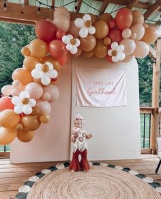 a room with balloons and decorations on the wall