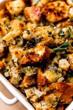 a casserole dish filled with stuffing and vegetables