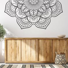 a black and white wall decal with an intricate flower design on it's side