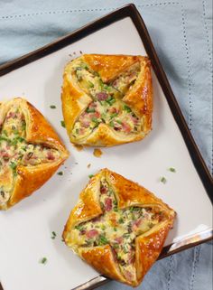 three pastries sitting on top of a white plate