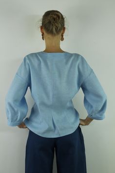 "Write the selected color in the message Handmade sky blue V neck linen blouse with front buttons and long sleeves, perfect for casual wear and suitable for any occasion in any season Details: - 100% natural linen produced in Europe ; - medium weight (180 gram per square meter); - color: sky blue, could be any from our colors catalog (color samples at the photo); Made to order, approximately a few days, If you have any questions please message me and I will be glad to answer. Size guide : Size X Blue Linen V-neck Blouse, Light Blue Relaxed Fit Linen Tops, Relaxed Fit Light Blue Linen Tops, Light Blue Linen Blouse For Spring, Light Blue Tops With Button Cuffs For Daywear, Light Blue Summer Tops With Button Cuffs, Light Blue Long Sleeve Tops With Button Cuffs, Blue Linen Blouse For Spring, Spring Blue Linen Blouse