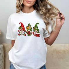 Hanging With My Gnomies Shirt, Christmas Gnomies Tee, Funny Christmas Shirt, Xmas Family Shirt, Christmas Shirt, Family Christmas Shirt,xMas Product Details ✨ Printing: High-quality ink ensures vibrant, long-lasting designs. 🎨 Style: Unisex sweatshirt with a versatile crewneck. 👕 Fabric: Pre-shrunk, soft air-jet spun yarn for ultimate comfort. 🌟 Durability: Double-needle stitching on the collar, shoulders, armholes, cuffs, and hem. 💪 Fit: Loose fit for a relaxed, comfortable feel. 😌 Sizing Casual Christmas Festive Shirt, White Casual Christmas Shirt, Casual Holiday Shirt For Gift, Casual Shirt For Holiday Gift, Casual Shirt As Holiday Gift, Gnome Family Christmas Shirts, Christmas Gnome Tshirts, Funny Christmas Short Sleeve T-shirt, Funny Christmas T-shirt Short Sleeve