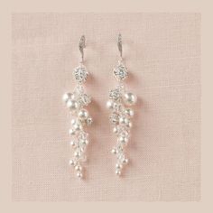 "Brilliant and full of sparkle!    These earrings are created with swarovski pearls, Swarovski crystals and crystal rhinestone balls for a truly luxurious look.   Gold earrings are made with Swarovski cream pearls and Swarovski crystal golden shadow crystal beads. Measurement of dangle portion of earring is 2 1/4\"  (3\" including ear wire) Matching bracelets: https://www.etsy.com/listing/70655952/pearl-bridal-bracelet-rhinestone-wedding https://www.etsy.com/listing/68987540/pearl-wedding-bracel Bridal Cuff Bracelet, Gold Wedding Earrings, Pearl Bridal Earrings, Pearl Bracelet Wedding, Long Pearl Earrings, Gold Earrings Wedding, Crystal Bridal Earrings, Drop Earrings Gold, Pearl Earrings Wedding