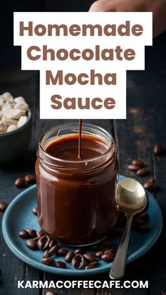 homemade chocolate mocha sauce in a jar with coffee beans on the side and spoon