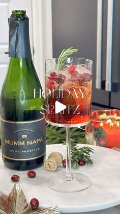 Robyn Greene on Instagram: "This holiday cocktail is everything—festive, easy to make, and absolutely delicious!  It’s my seasonal twist on the classic Aperol Spritz, and it’s guaranteed to impress your guests (or just treat yourself!).

Watch the video for the full recipe and step-by-step guide!

The secret touch? Festive ice cubes made with cranberries and rosemary—because it’s all about those little details! Just freeze them into your ice tray with water, and voilà!

This is the perfect sip for cozy nights by the fire or holiday parties. 🥂 
Cheers to the season, and don’t forget to tag me if you try it!

#christmasparty #christmascocktails #holidayrecipes #holidayhosting #christmasseason #christmasdrinks #cranberrycocktail #champagnelovers"