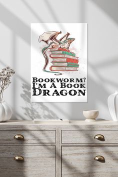 a book worm i'm a book dragon poster on a wall above a dresser