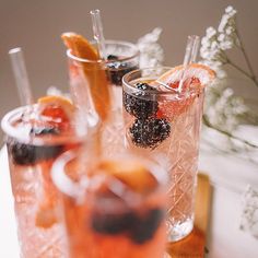 three glasses filled with different types of drinks